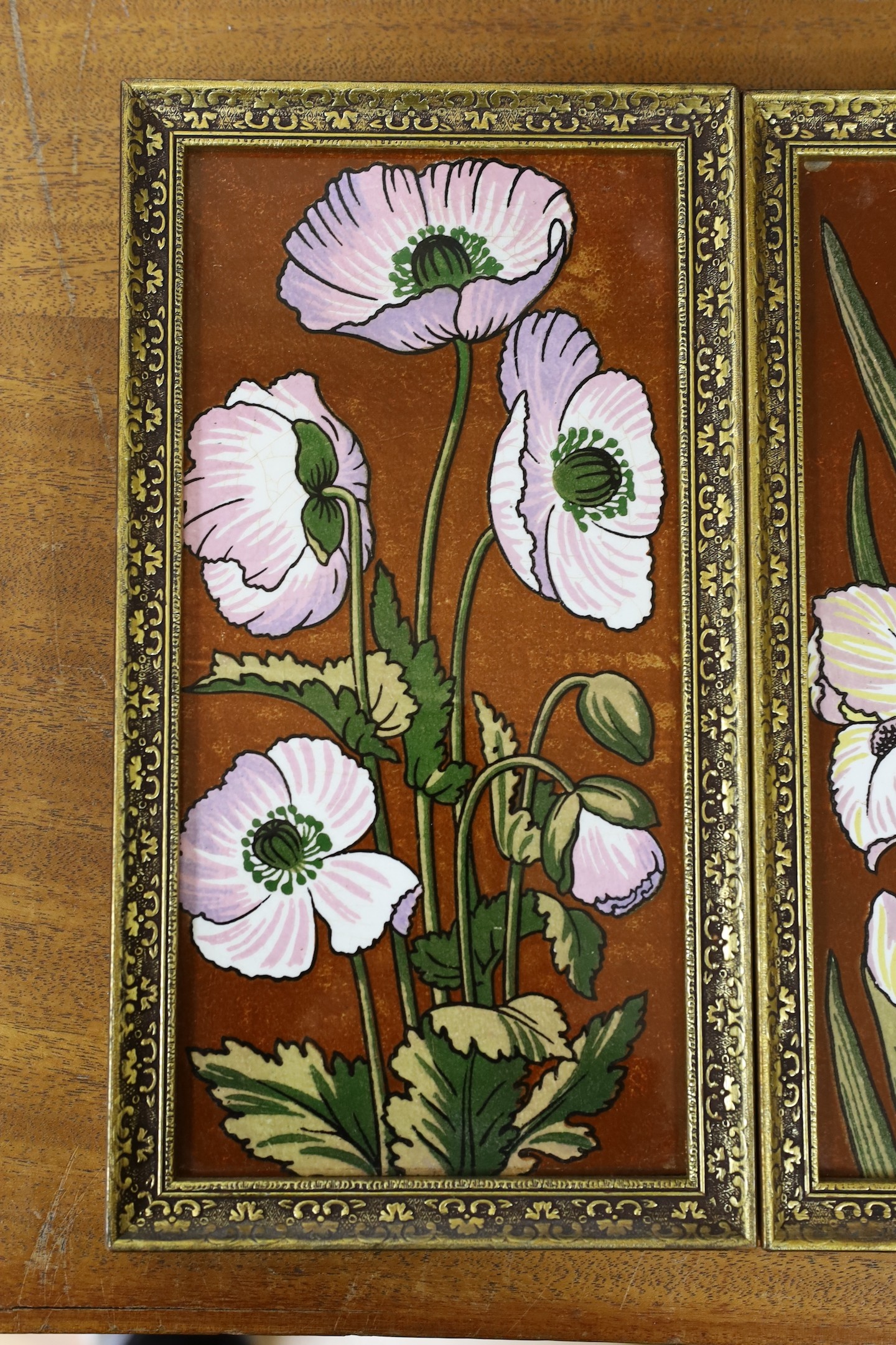 A pair of late 19th century Aesthetic pottery tile panels, 33 x 18cm